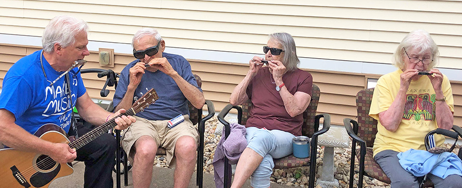 Lou Oswald taught Park Place folks how to play the harmonica during Make Music Platteville Day!