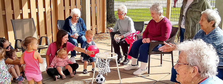 Some of the Park Place ladies enjoying a visit from Great Beginning Learning Center kiddos.