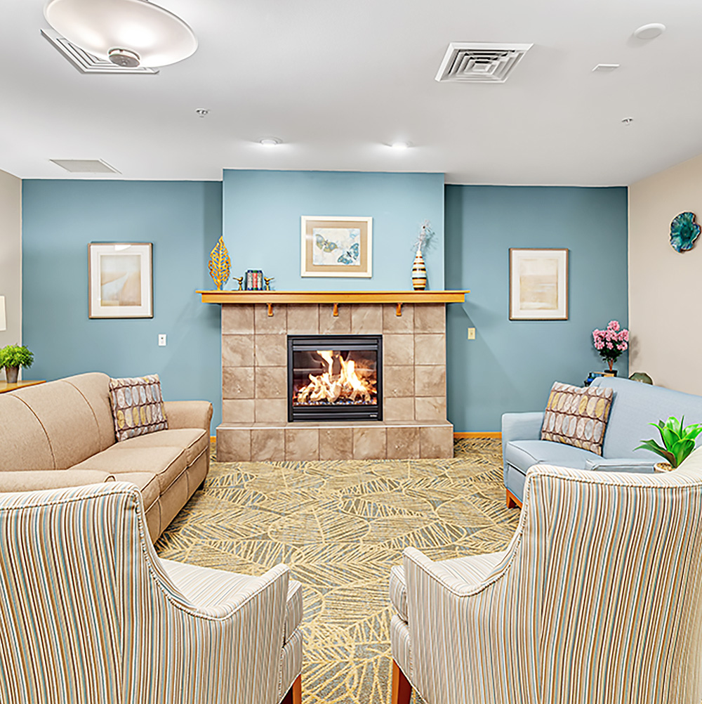 Park Place Apartments great room has a cozy fireplace